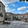 Historic cobblestone streets and stone houses in Sortelha, Portugal, showcasing traditional architecture.